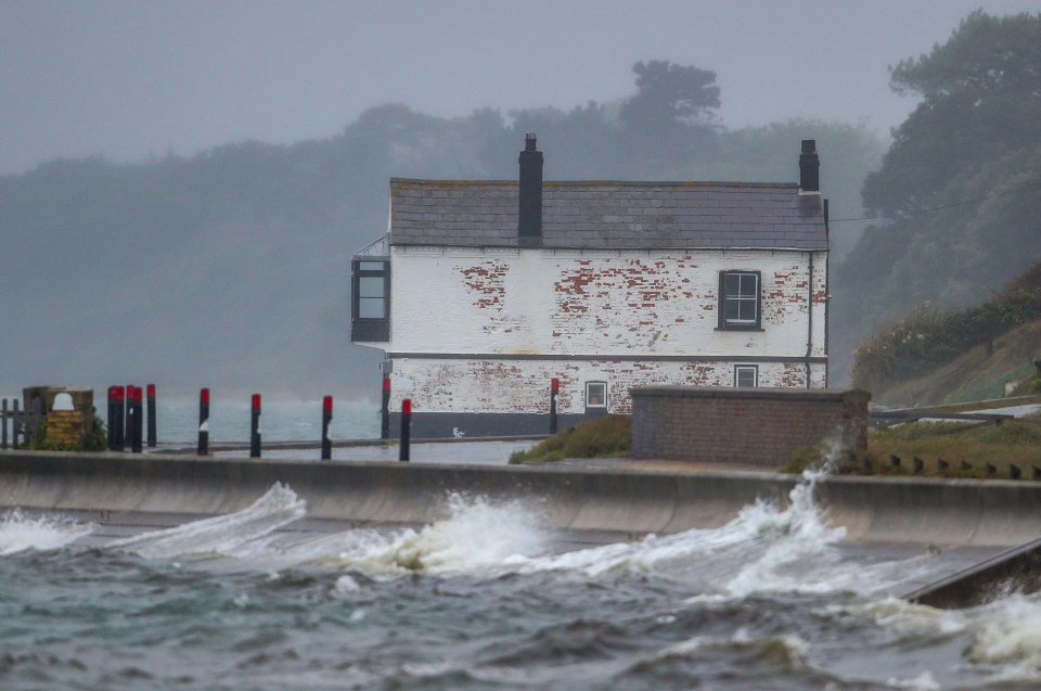 The old Coastguard Watch House in Lepe, Hampshire is battered yesterday by 36 mph gusts