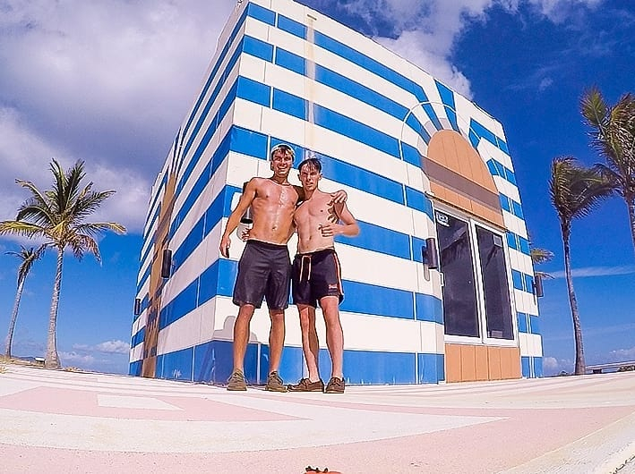 Andy Bracco and Jon Megna pose near Epstein’s temple