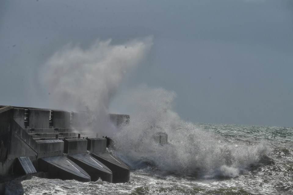 Brighton marina is buffered by high winds and waves from Storm Ellen