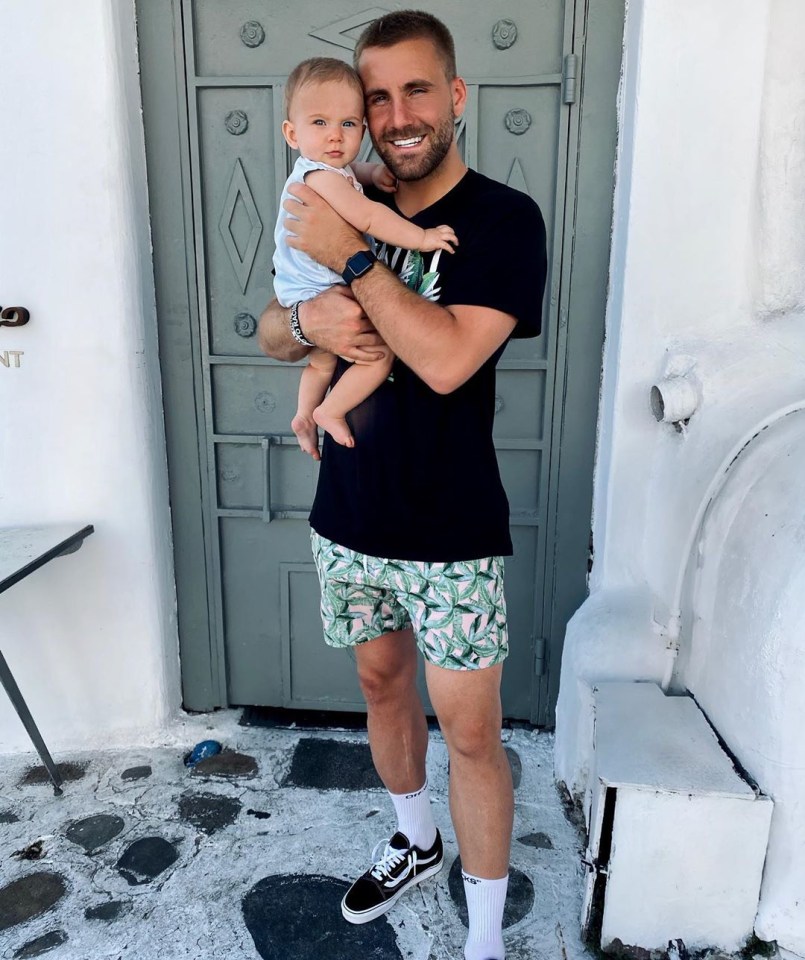 Luke Shaw wore a black Amiri T-shirt and colourful shorts on his Mykonos break