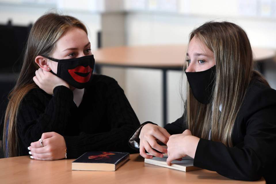 Pupils wear face masks as they sit in class at Springburn Academy school in Glasgow 