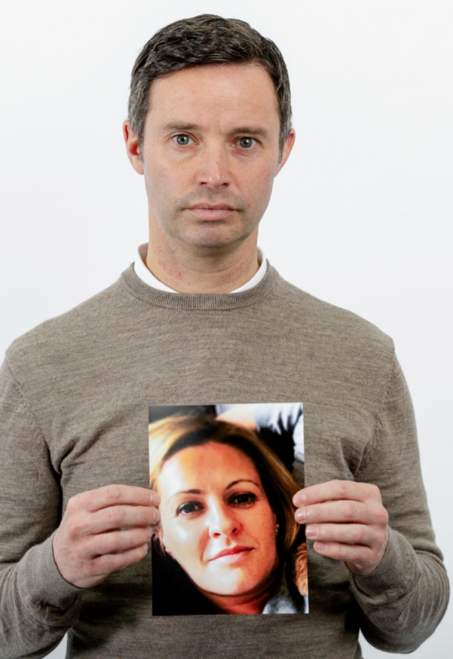 Dan is pictured above holding a photo of his late wife Caroline