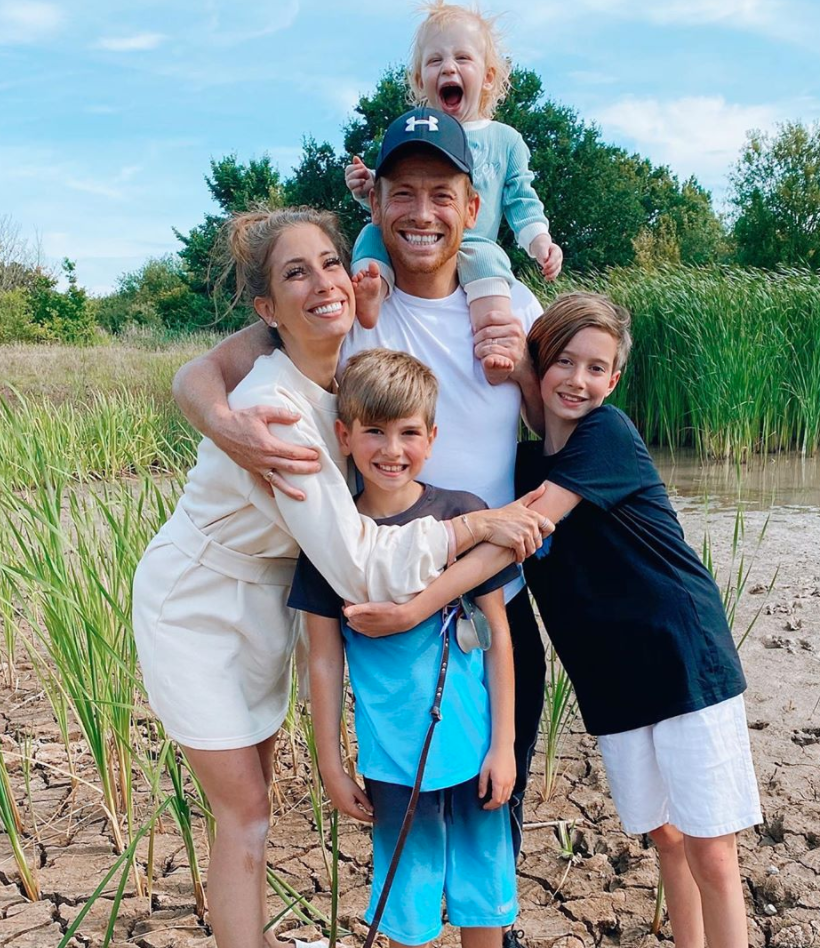 Stacey cuddles her sons Leighton and Zachary as Joe carries baby Rex on his shoulders