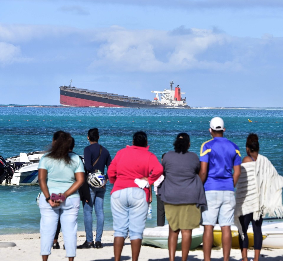 Still sinking: Japanese tanker MV Wakashio can be seen partly submerged after striking a reef at Pointe d'Esny in Mauritius