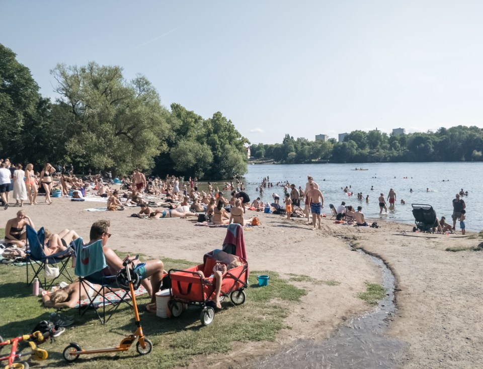  Relaxing at the lakeside beach in Stockholm, capital of Sweden, on August 9