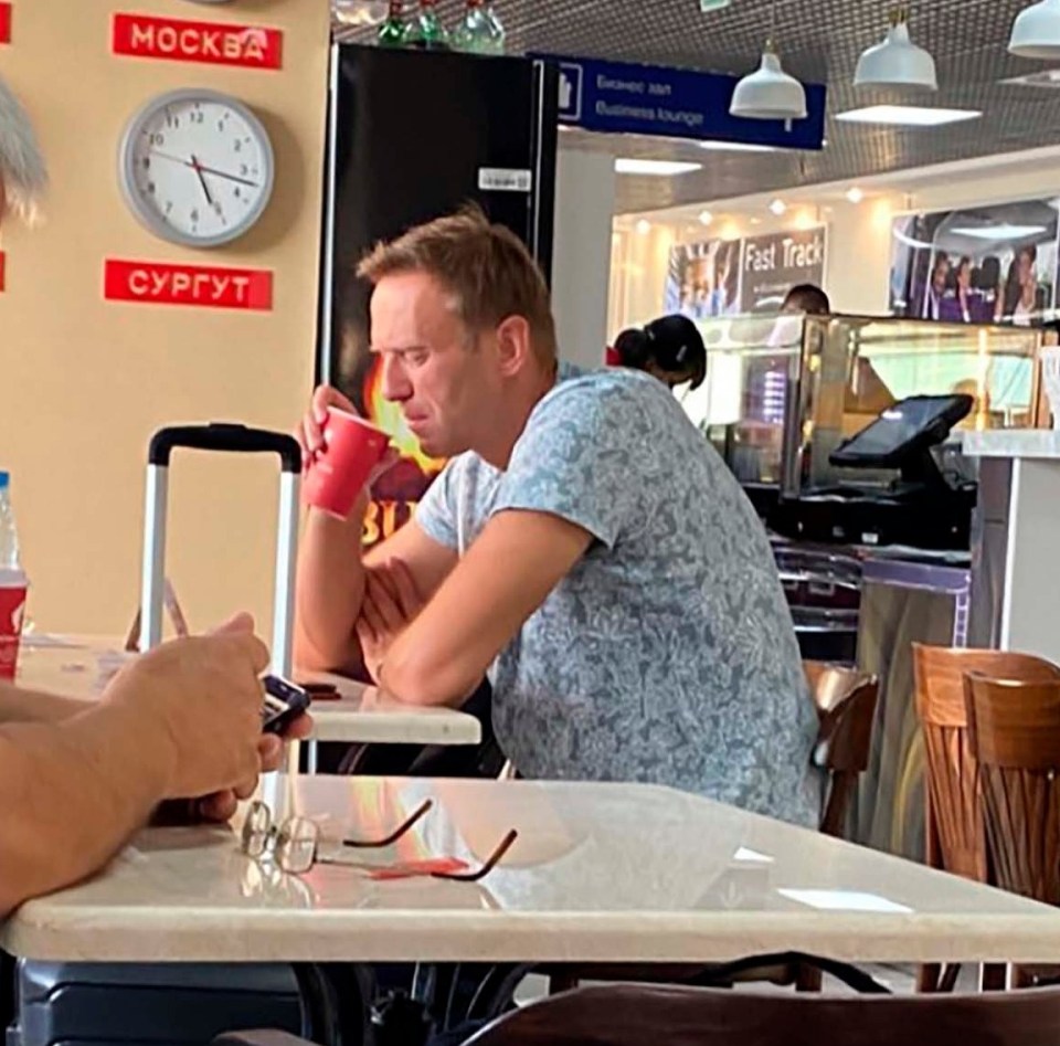 Navalny was pictured drinking tea in the airport before being taken ill