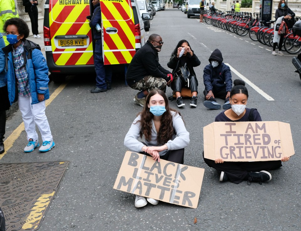 One sign read ‘I am tired of grieving’