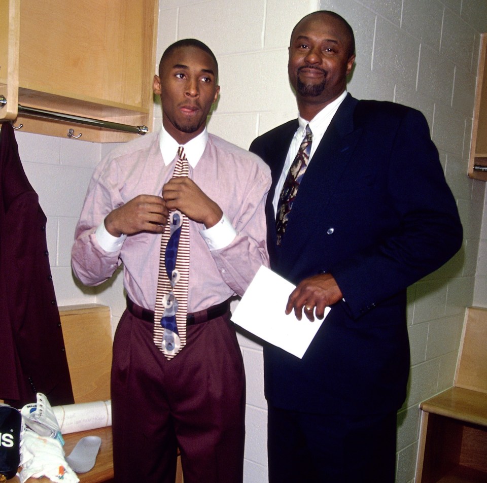 Kobe and his dad pose in the locker during a 1996 game in Pennsylvania