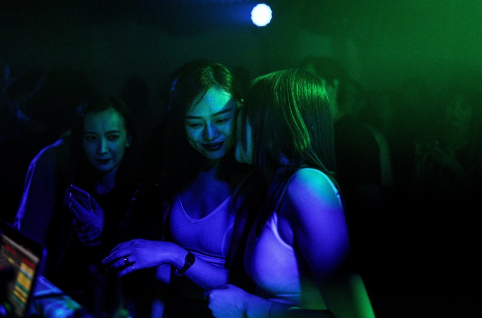 Two girls get close at the club in Wuhan