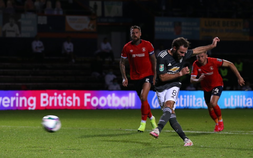 Juan Mata converts a 44th-minute penalty against Luton