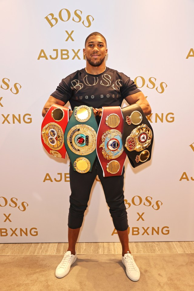 AJ showing off his heavyweight titles and fashion line 