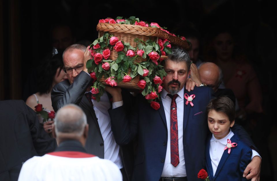 Dad Andrew Roussos, 43, and brother Xander hold Saffie's coffin at the funeral