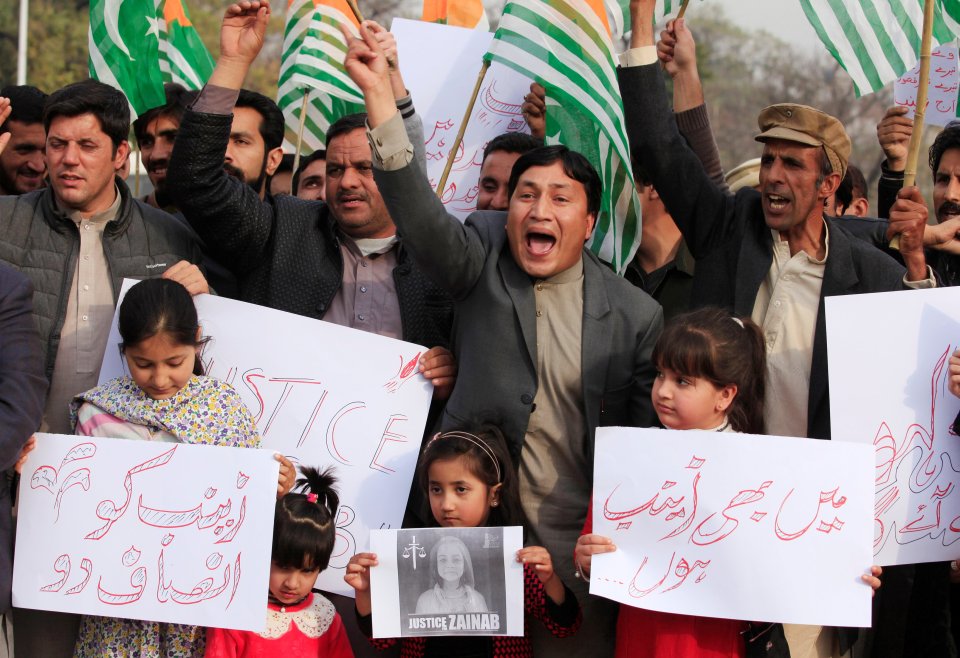 Demonstrators chant slogans to condemn the rape and murder the 7-year-old girl