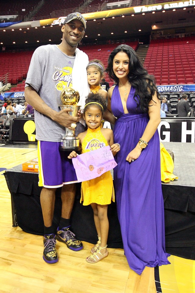 Doting dad Kobe poses for a photo with his wife Vanessa and daughters Gianna, top, and Natalia