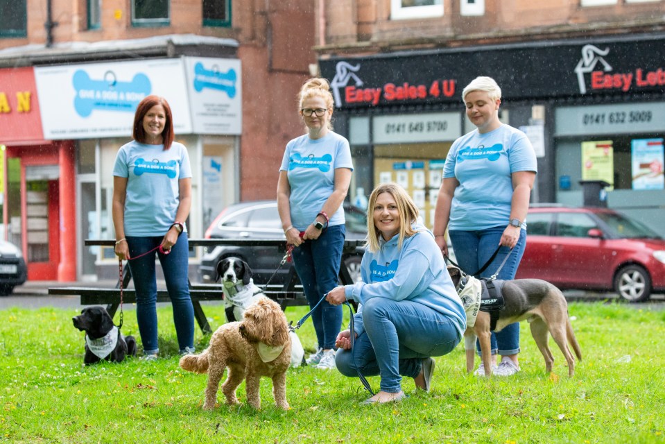 Founder Louise Russell (right), with her dog Cooper, with members of her team Wendy Hood, Julie-Anne Anderson-Mckinlay and Linsay Macphail