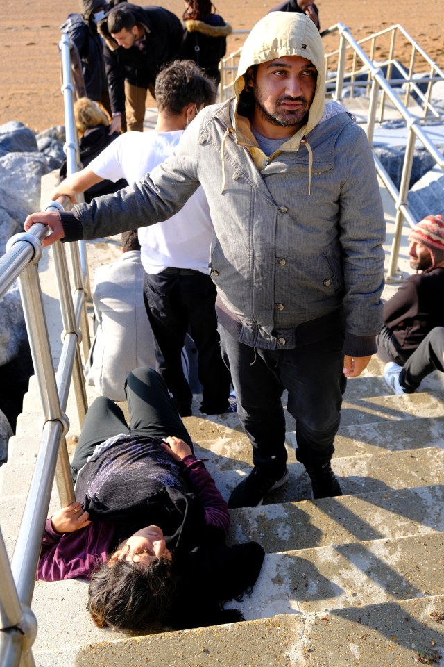 Exhausted migrants collapse after crossing the Channel and making it to Dover