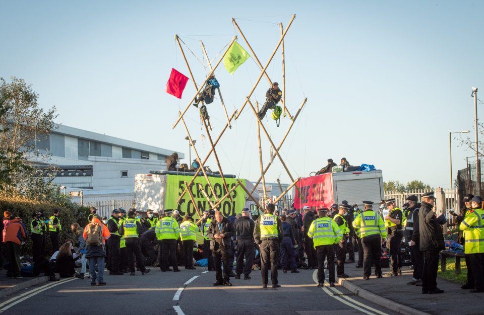 Police stood by as protesters blocked the presses