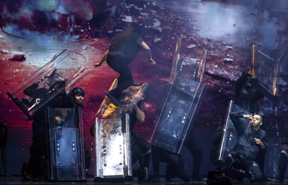 Riot shields litter the stage in the routine, which charts events in 2020