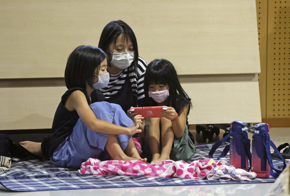 Local residents take refuge at a site acting as an evacuation centre