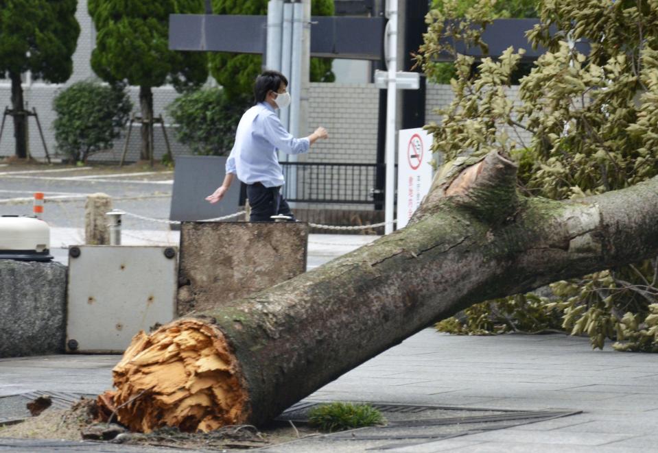 The tropical cyclone has destroyed buildings, flooded roads and knocked out power to thousands of homes