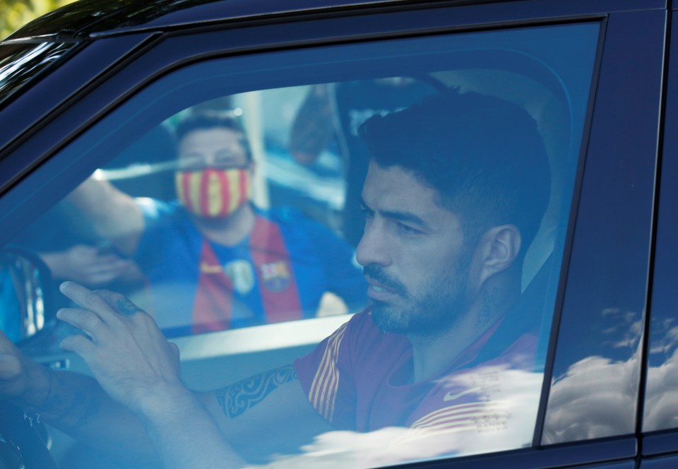 Luis Suarez was clearly upset as he arrived and left Barcelona training for the last time before joining LaLiga rivals Atletico Madrid