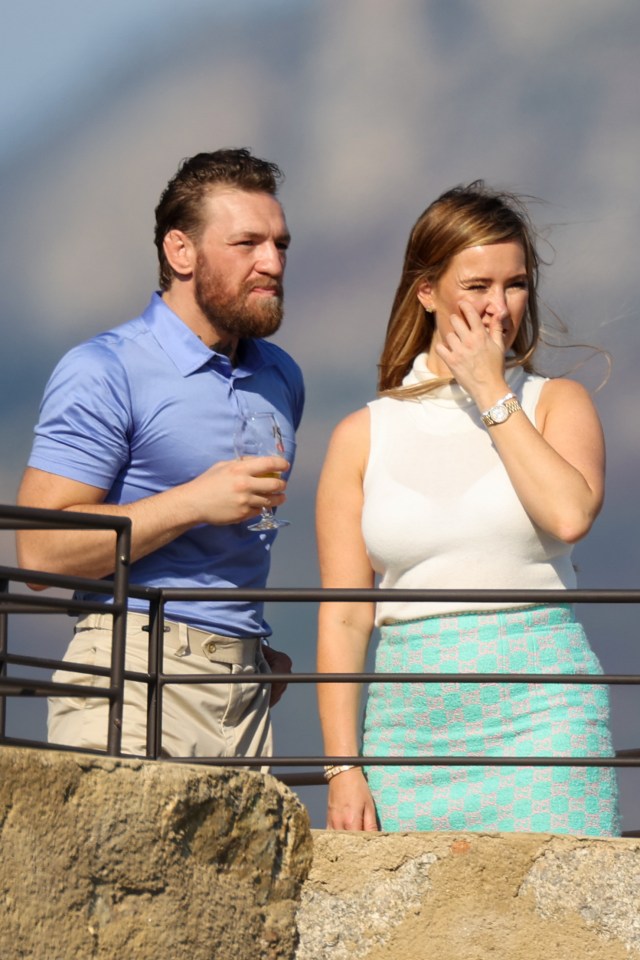 McGregor had a drink in his hand as the couple enjoyed the view