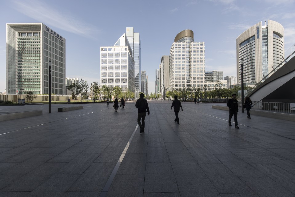 Pedestrians walk along a street in Suzhou, China, as local authorities announced the introduction of ‘Civility Code’ rating system