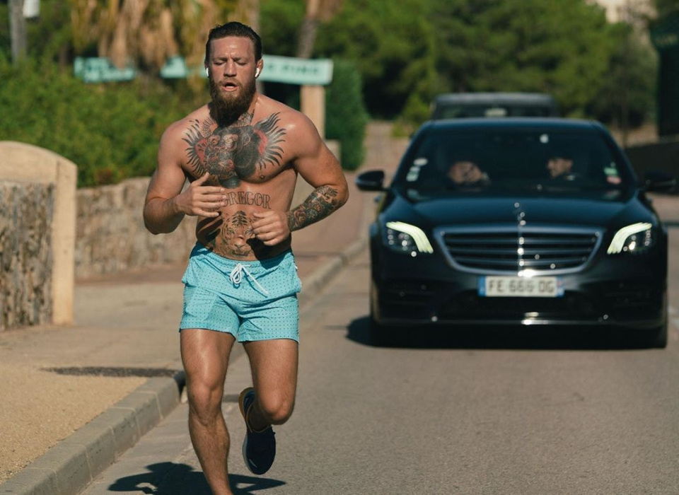 Conor McGregor is snapped running in Corsica earlier this week, where he has reportedly been arrested 