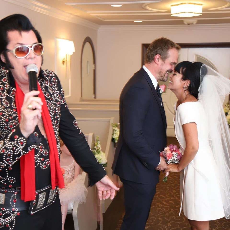 The couple looking loved up with the Elvis impersonator