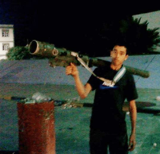 New pictures have emerged showing Hashim holding a huge rocket launcher during a trip to Libya