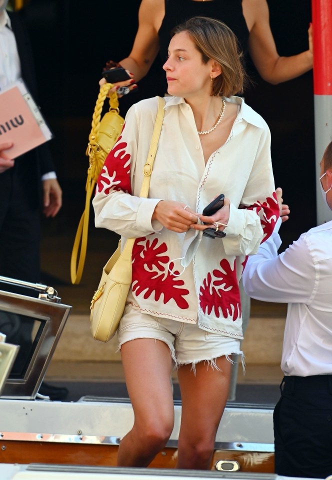 The Crown star paired the jacket with a pair of white shorts