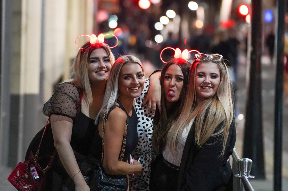 A group of four friends strike a pose in Sheffield