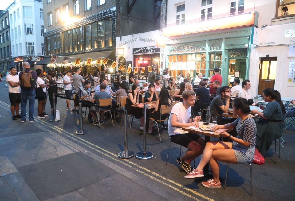 Groups of young people are seen out drinking and dining in Soho, London