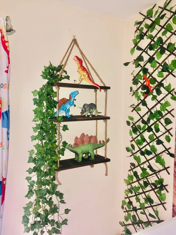 The creative mum added models of dinosaurs on shelves and covered the walls in ivy