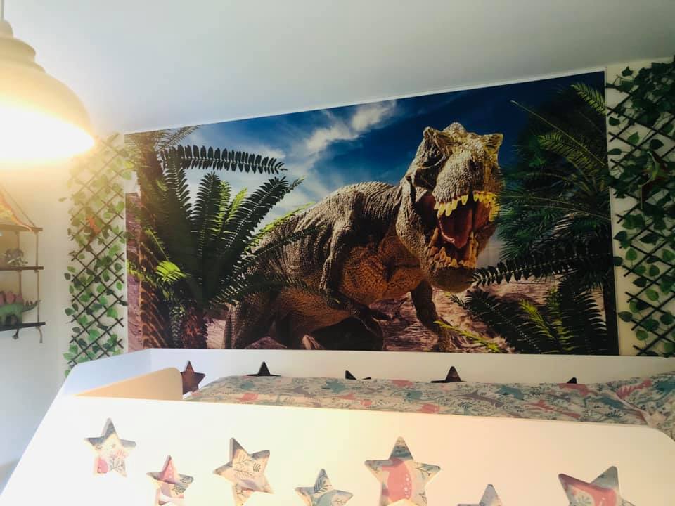 All of the dinosaur artwork is attached to the wall by command hooks, as the home is rented