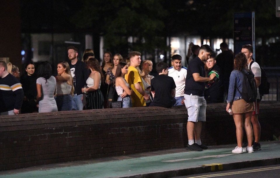 Groups of students queued up to enter sitting-only nightclubs