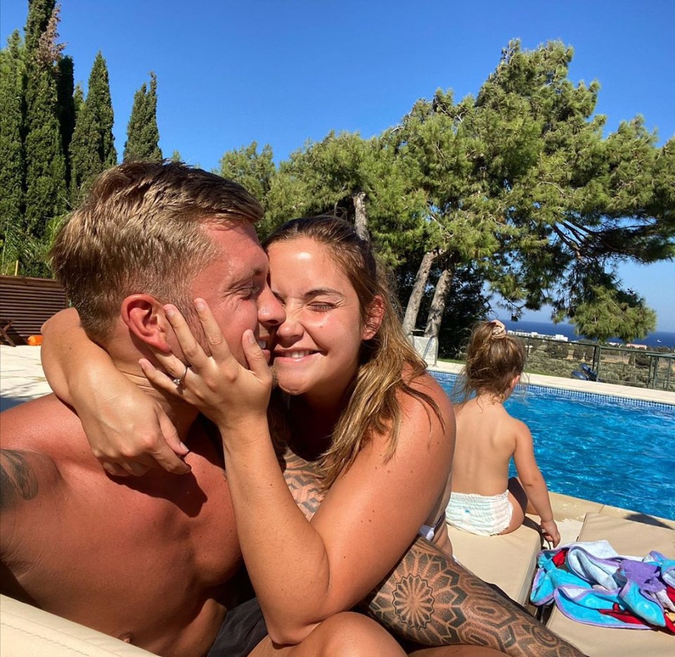 Jacqueline Jossa cuddles Dan Osborne on holiday in a throwback snap