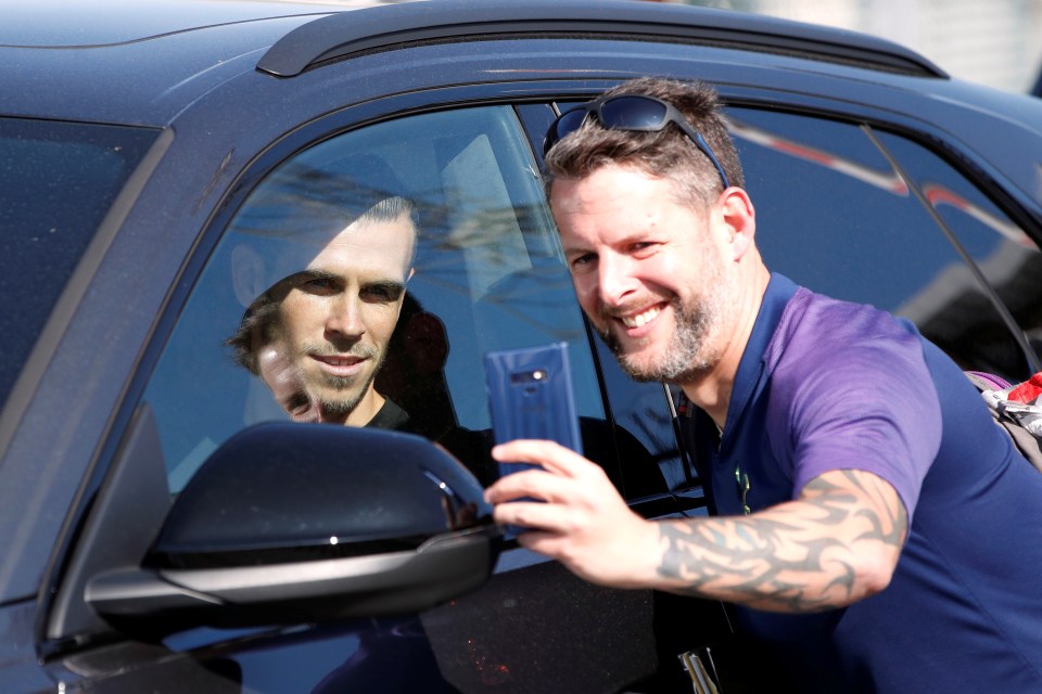 Bale posed for a selfie as he jumped into a car en route to Spurs