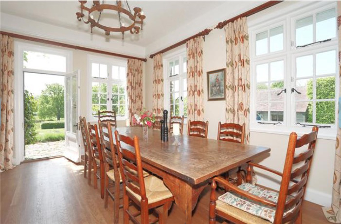 The dining room looks out onto their acres of land