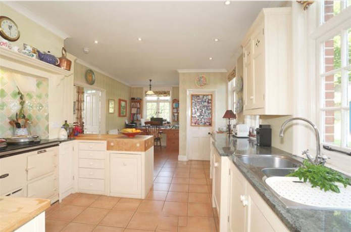 Their kitchen currently boasts white cupboards and marble work tops