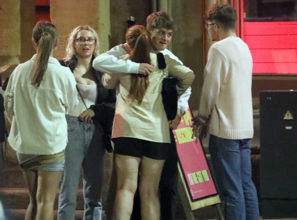 Friends were seen hugging each other in Leeds last night