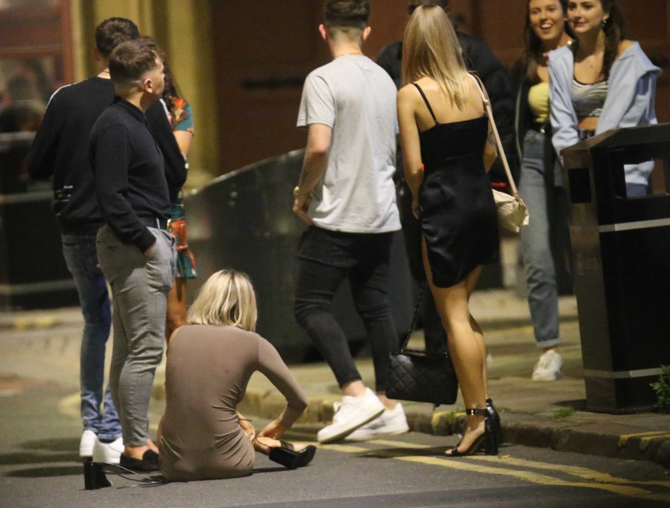 One woman was seen adjusting her shoes on the ground in Leeds