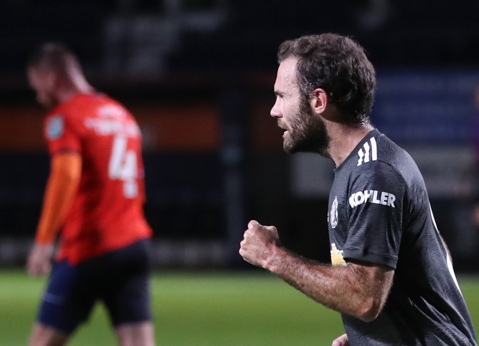 Juan Mata celebrates giving United the lead at Kenilworth Road