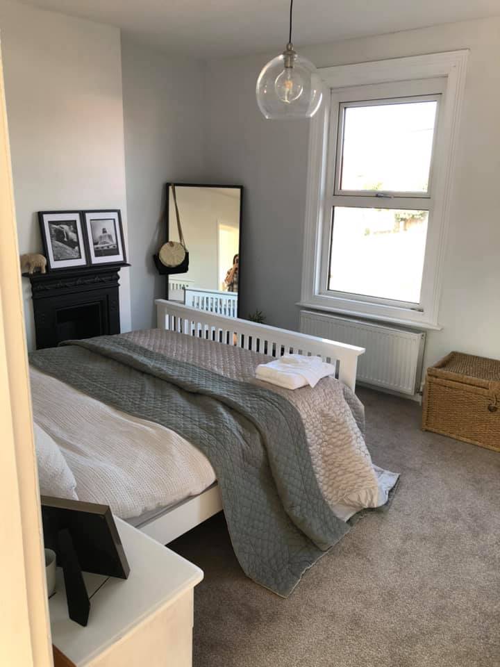 Her main bedroom now features modern grey hues