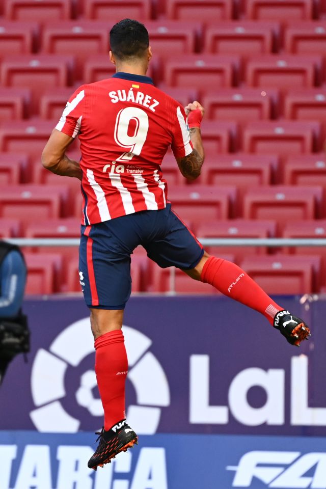 Luis Suarez celebrates scoring on his Atletico Madrid debut