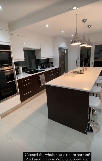 The kitchen follows an all white colour scheme