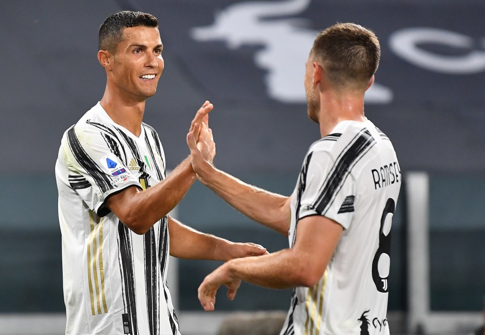 Juventus goal-taker Cristiano Ronaldo takes the congratulations of goal-maker Aaron Ramsey