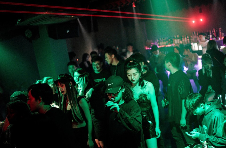 A crammed nightclub in Wuhan where the virus first appeared last December