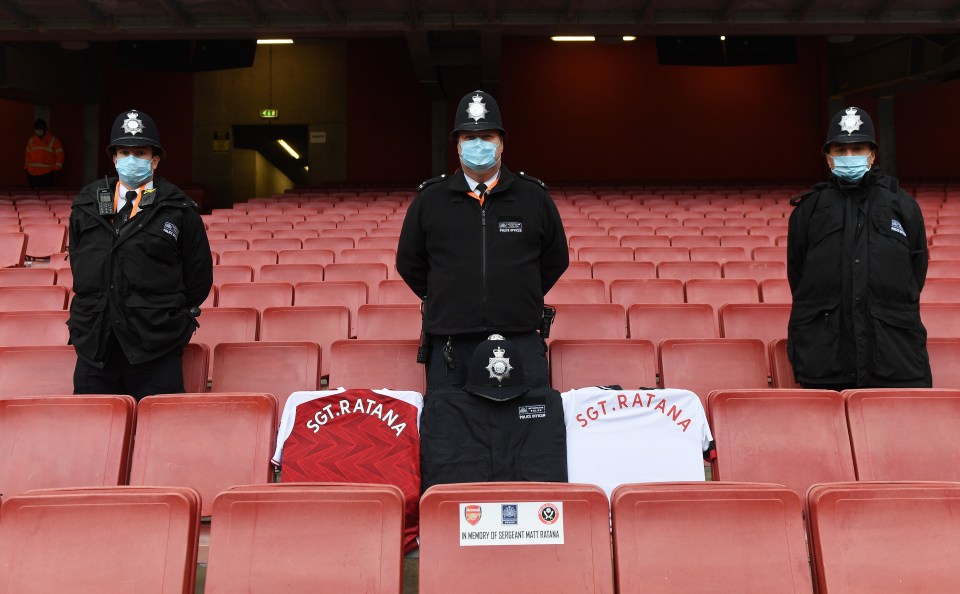 Police officers' silent tribute to fallen comrade Sgt Matt Ratana with the club shirt adorning his name at the Emirates today