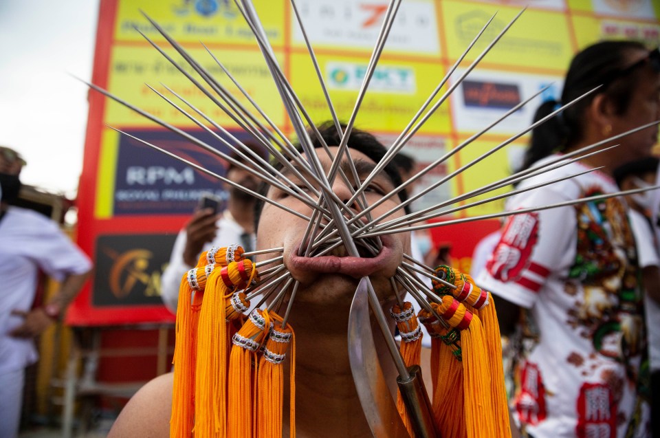 A Taoist devotee parades at the Phuket Vegetarian Festival